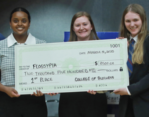 UMW seniors (L to R) Helen Worku, Taylor Munger and Katie Reif pose with judges for placing first in the Eagle Innovation StartUp Pitch Competition. Photo by Karen Pearlman.